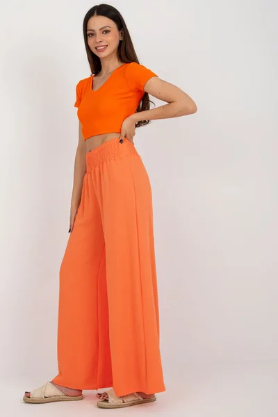 Široké letní oranžové dámské kalhoty FPrice