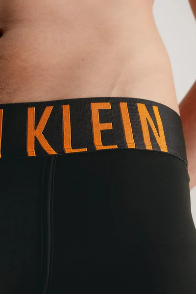 Stylové pánské boxerky s oranžovým nápisem Calvin Klein