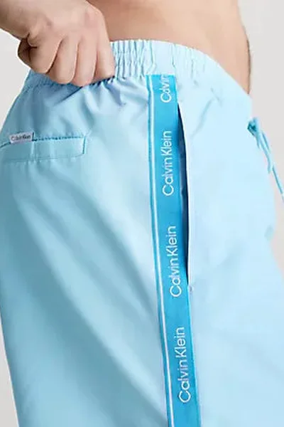 Světle modré pánské koupací šortky Calvin Klein S - 4XL