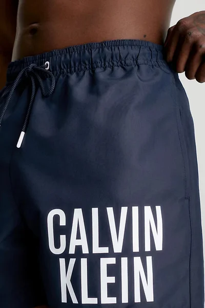 Tmavě modré pánské plavky s logem Calvin Klein