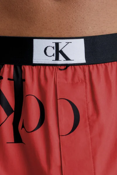 Cihlově oranžové pánské trenýrky s nápisy Calvin Klein