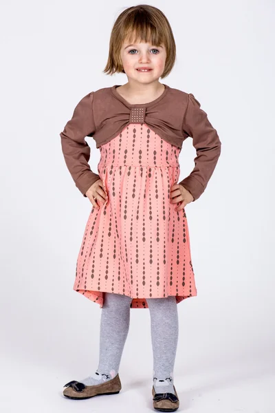 Bavlněné dívčí šaty s potiskem a dlouhými rukávy broskvové barvy FPrice